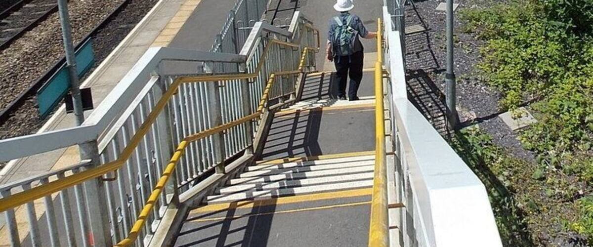 Steps or ramp access, platform 1, Llanharan railway station Those unable or unwilling to use the steps can use the ramps on the slope on the north side of the station. Access to and from platform 2 is on flat land on the south side.