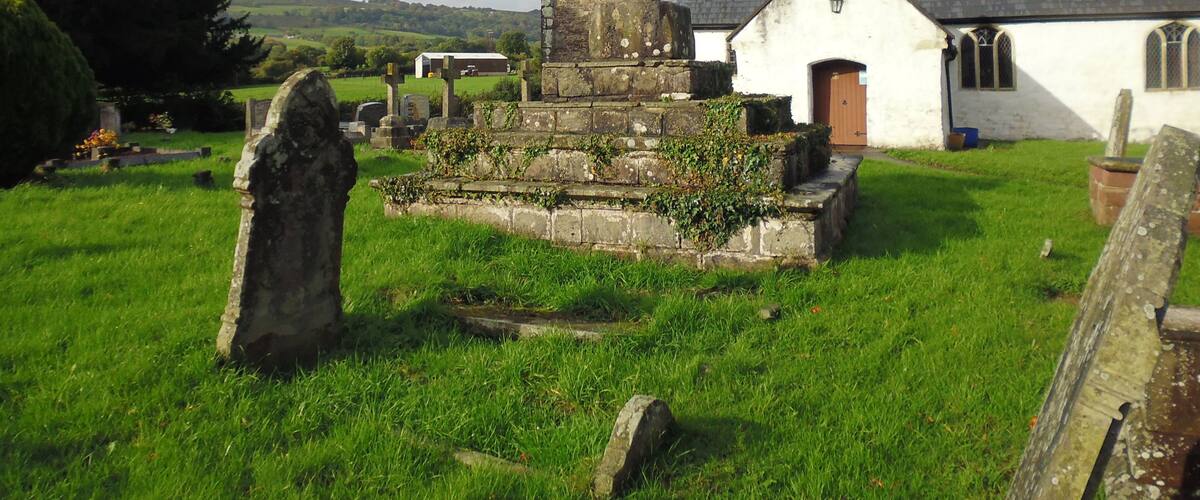 Remains of medieval preaching cross in the graveyard of St Peter's Church. Henllys, Cwmbran. This is a scheduled ancient monument in Torfaen.