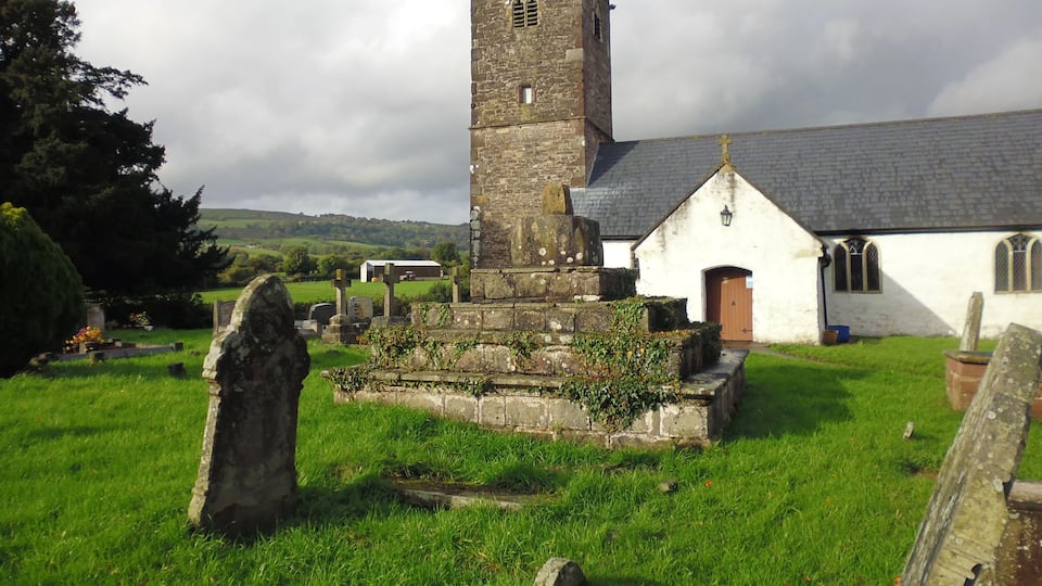 Remains of medieval preaching cross in the graveyard of St Peter's Church. Henllys, Cwmbran. This is a scheduled ancient monument in Torfaen.