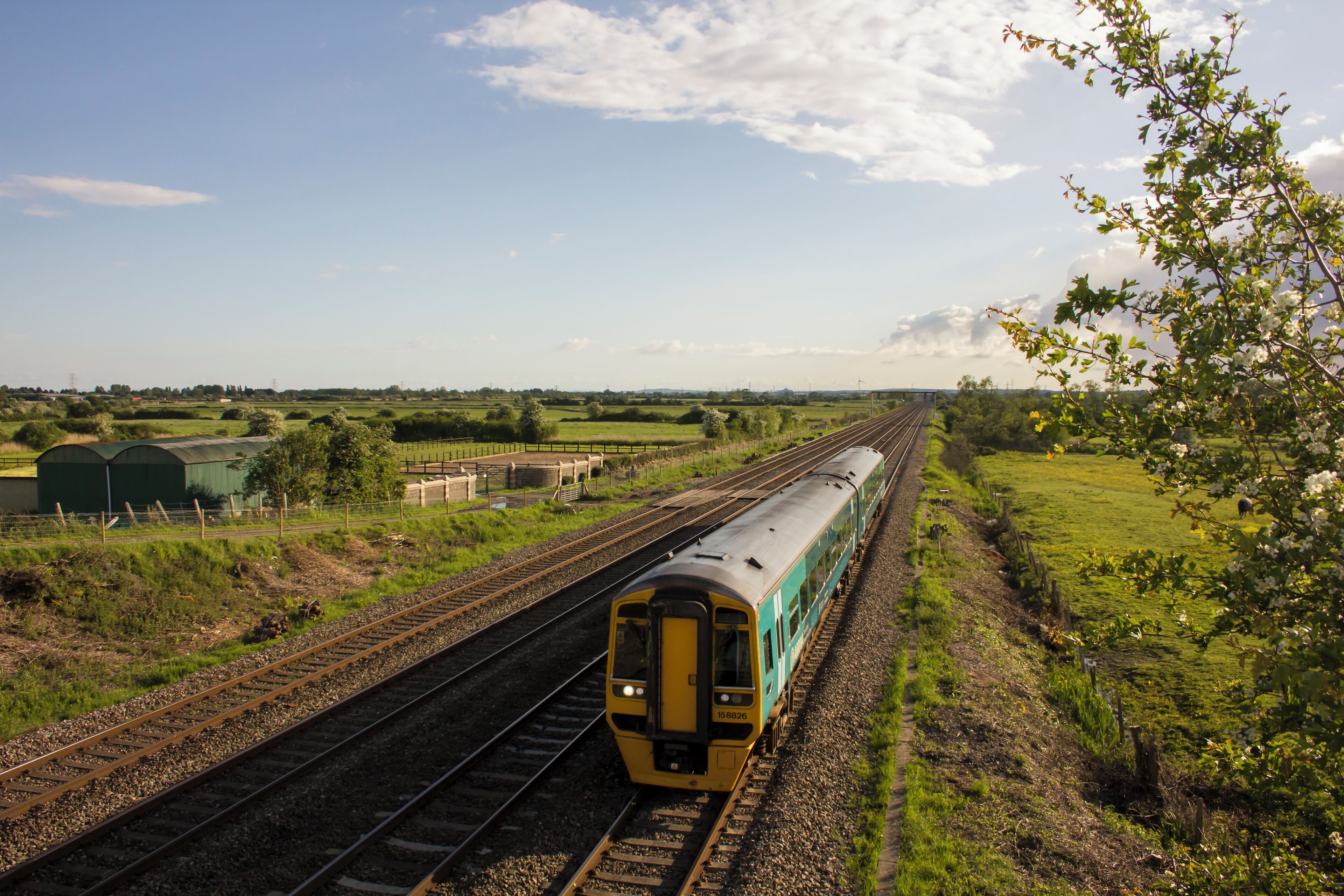 An Arriva Trains Wales class 158 DMU is seen on the South Wales Mainline between Cardiff and Newport.