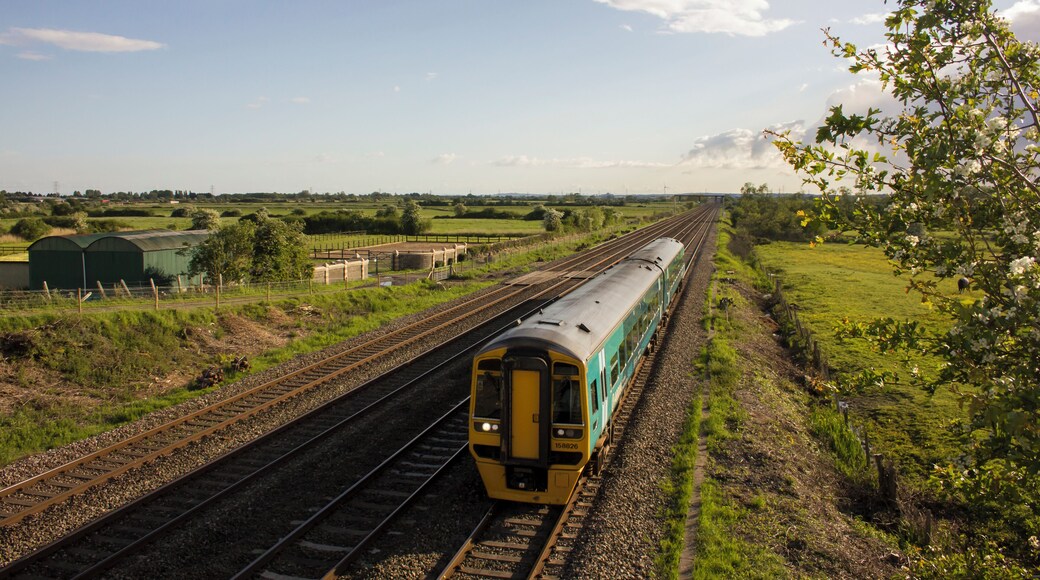 An Arriva Trains Wales class 158 DMU is seen on the South Wales Mainline between Cardiff and Newport.