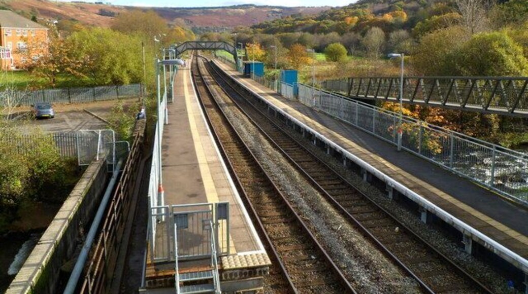 Ystrad Rhondda railway station. The station is on the Rhondda Line, between Llwynypia station (about a mile ahead) and Ton Pentre station, a little less than a mile behind the camera. The twin tracks through the station merge into one track beyond the footbridge ahead. Of interest to trivia fans - Ystrad Rhondda is alphabetically the last railway station in the UK.