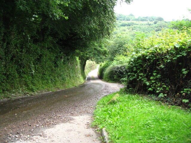 Ty-bwmpyn Lane This picture was taken from the entrance to the drive to Yew Tree Cottage. It shows how narrow the lane is. The recent heavy rainfall has caused gravel to be washed onto the road.