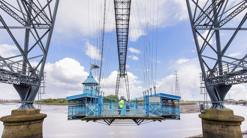 The coolest "bridge" I have ever "driven" across! Drive aboard and take flight over the River Usk in this 110 year old engineering marvel. Only six of these historic bridges remain in operation, and the Newport Bridge is the longest with a 196m span (645ft).
A modern highway bridge passes nearby, so these days the bridge operates as a novelty. Show up on either side, and the operator will come pick you up! You can also climb the steps and walk across the 54m (180ft) high catwalk.