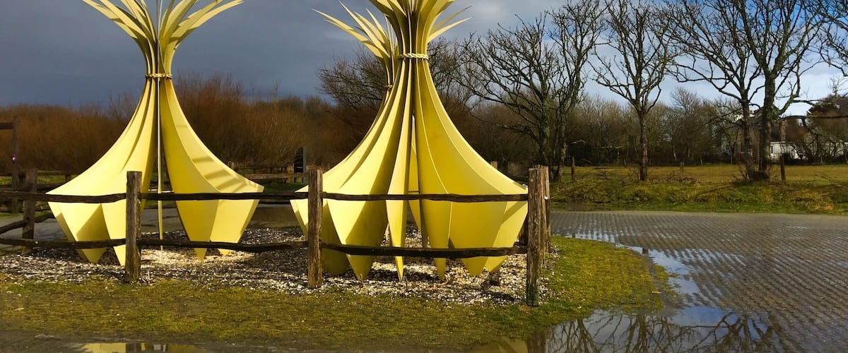 Newborough Gafrod. Sculpture by Ann Catrin Evens. This depicts bundles of marram grass collected by residents of Newborough on Anglesey, dried then woven to make mats.