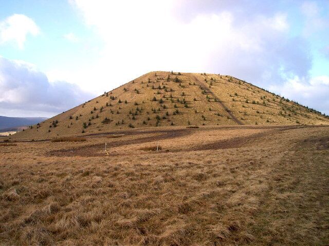 Tip above Tylorstown. This tip is one of the few mountain top tips left and can be seen from as far away as Exmoor, the Brecon Beacons and the Blorenge. (Following the disaster at Aberfan in 1966 virtually all of the mountain top tips were removed.) The Banana tip was situated alongside the railway line between the villages of Tylorstown and Ferndale and shaped like a banana - hence it's name, it was moved very many years ago and is no longer to be seen.
