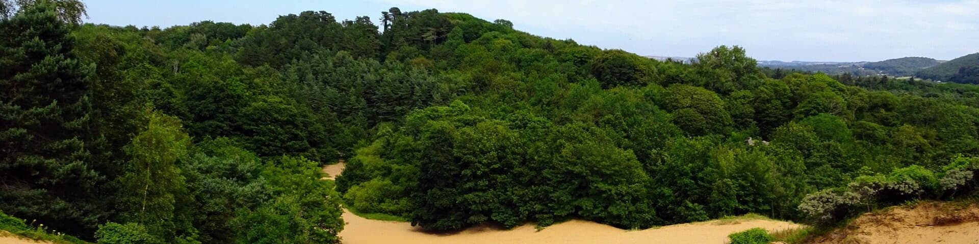 Tucked away on the Coast line not far from Cardiff are these impressive sand dunes. The biggest sand dune in the area labeled 'big dipper' is an impressive 60 meters high making it the second highest sand dune in Europe. Free to roam these dunes with many walking trails (All bare feet hiking!)