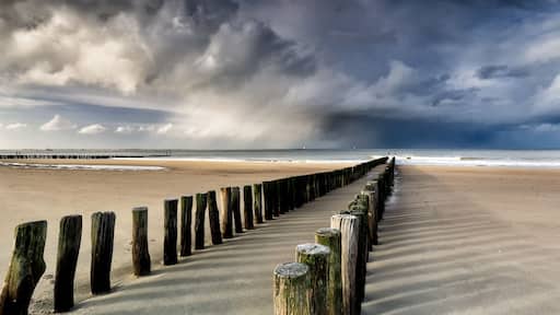 shower clouds over North sea beach
