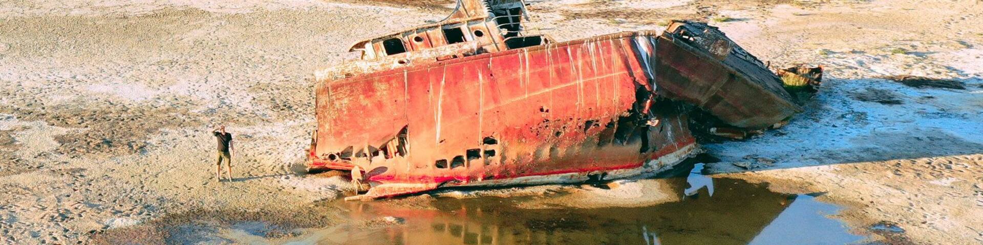 Old rusted ships are scatted along the shore of the receding Aral sea. The booming cotton industry in the south has slowly drained the lake. Very recently, efforts have been made to restore the lake to its former volume. Soon this ships will gone.