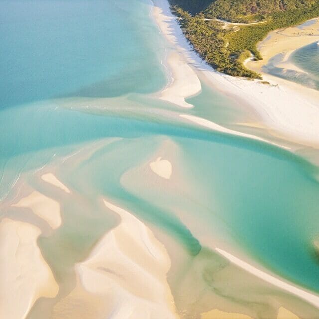 Formed by tidal movement the sand swirls of Hill Inlet are a sight to see from the air. From ground level it's a pristine beach but once you're flying above it the landscape comes to life. #australia #beach #paradise
