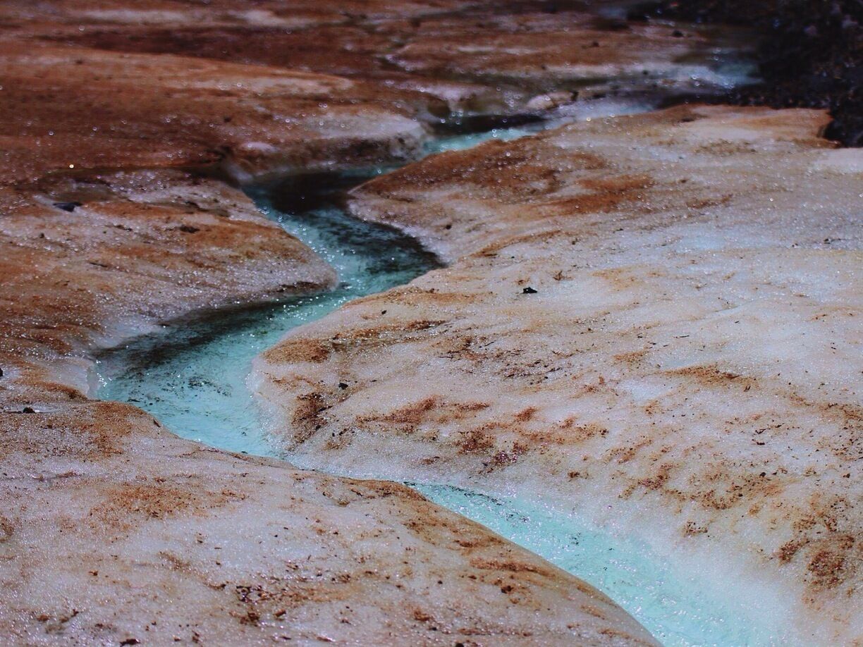 Yolin Am, Mongolia. 
The glacier runs through a gorge. A river runs through the glacier. A nice hike. 
#troverdetour