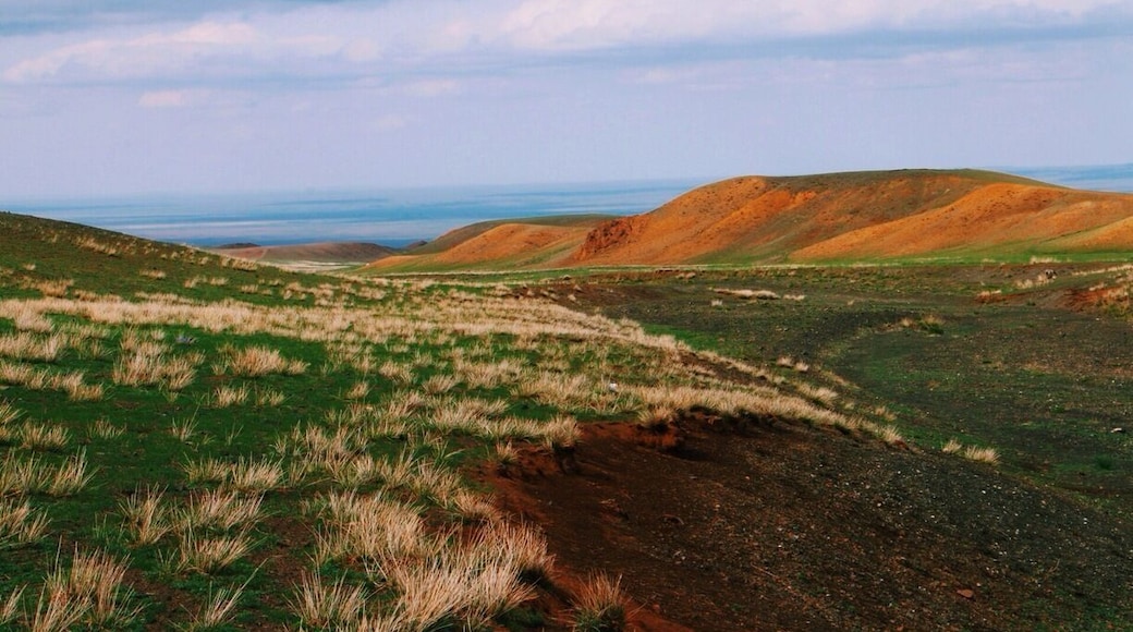 Just near Yolin Am, Mongolia. I love the red soil of the hillsides in this area. #troverdetour