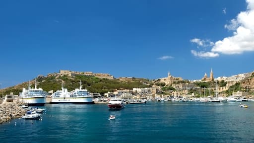 The town of Mġarr grew up around the shallow harbour which shares its name. Ferry services to Malta were in operation by 1241, and fishing was already established. While the area around the harbour was developed over the following centuries, there was little development of the harbour itself until 1841, when a breakwater was constructed to provide more shelter to the port. This breakwater was strengthened and extended several times up to 1906. A larger breakwater was constructed between 1929 and 1935, and two more in 1969; on the completion of the latter, the area of the port was expanded to 121,400 square metres.