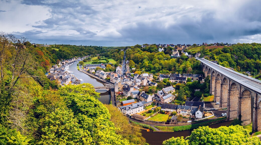Aerial view of the historic town of Dinan with Rance river with dramatic cloudscape, Cotes-d'Armor department. Brittany (Bretagne), France