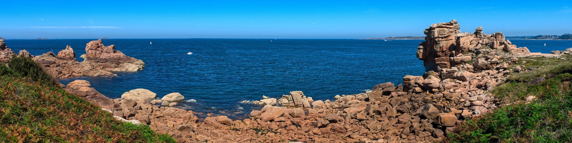 Monolithic blocks of pink granite in the Cotes d'Armor in Brittany, France. Pink granite coast
