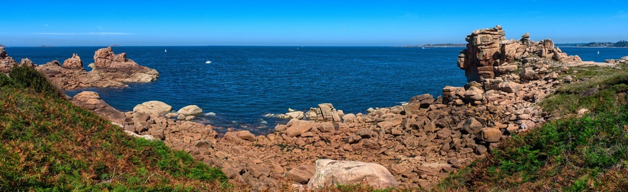 Monolithic blocks of pink granite in the Cotes d'Armor in Brittany, France. Pink granite coast