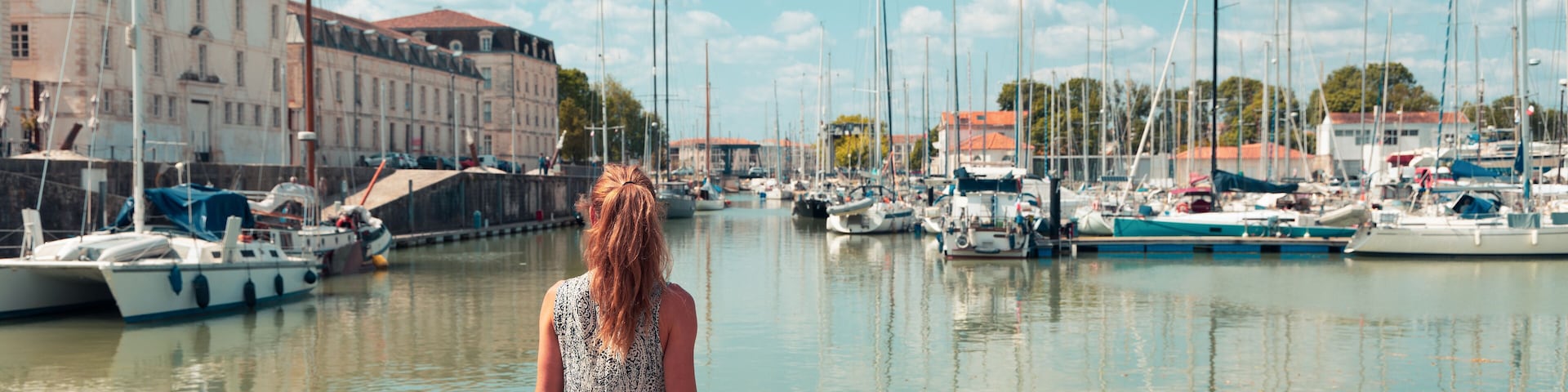 Woman tourist visiting Rochefort city and port- Charente Maritime in France