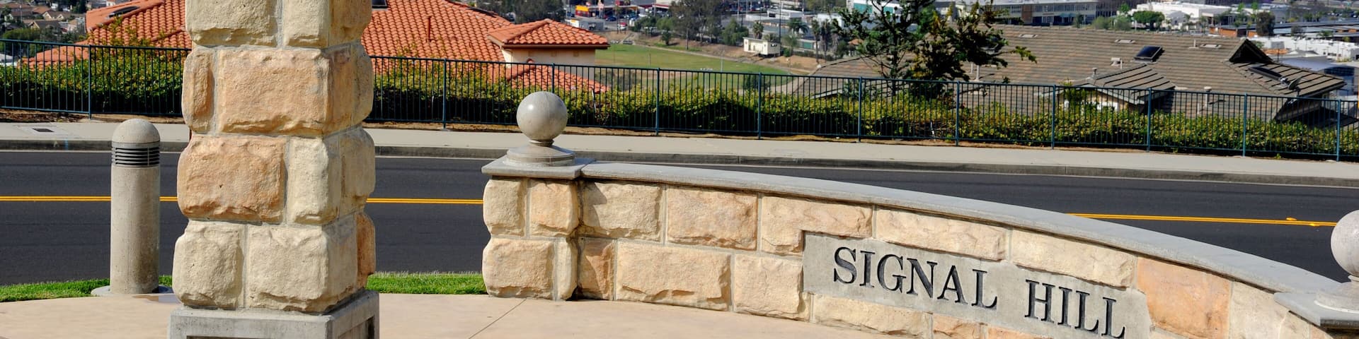 Signal Hill view over the city of Long Beach with the downtown high rise buildings and Pacific Ocean in the background.