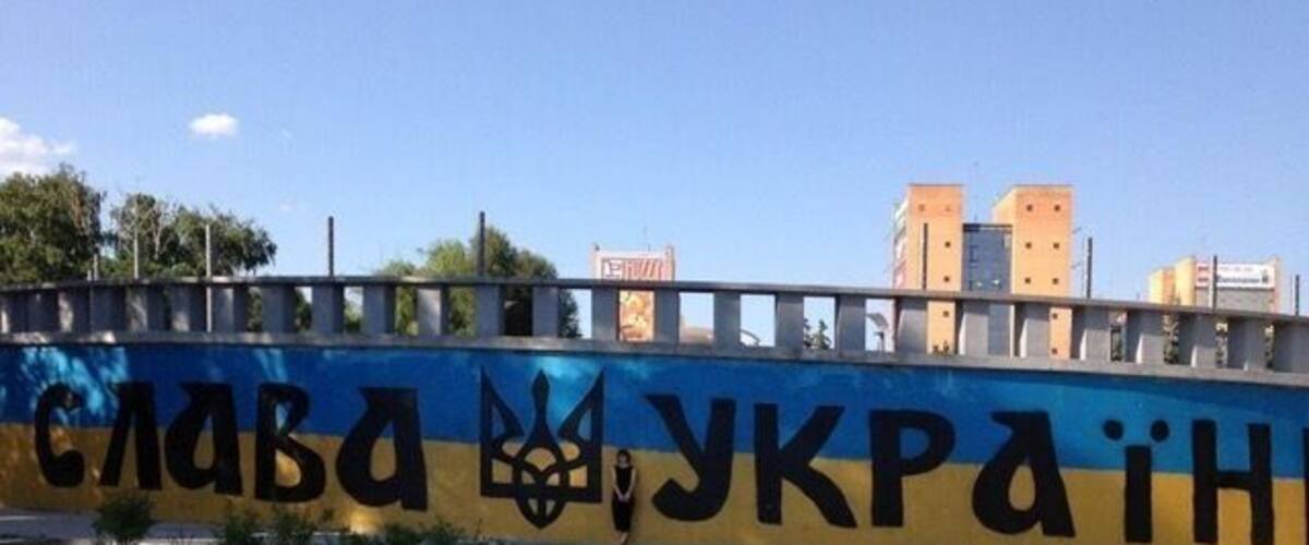 A bridge with graffiti on the side.