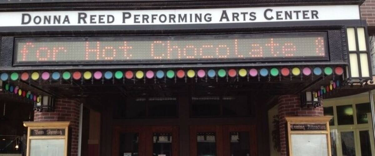The entrance to the Donna Reed Performing Arts Center with a marquee reading "For Hot Chocolate."