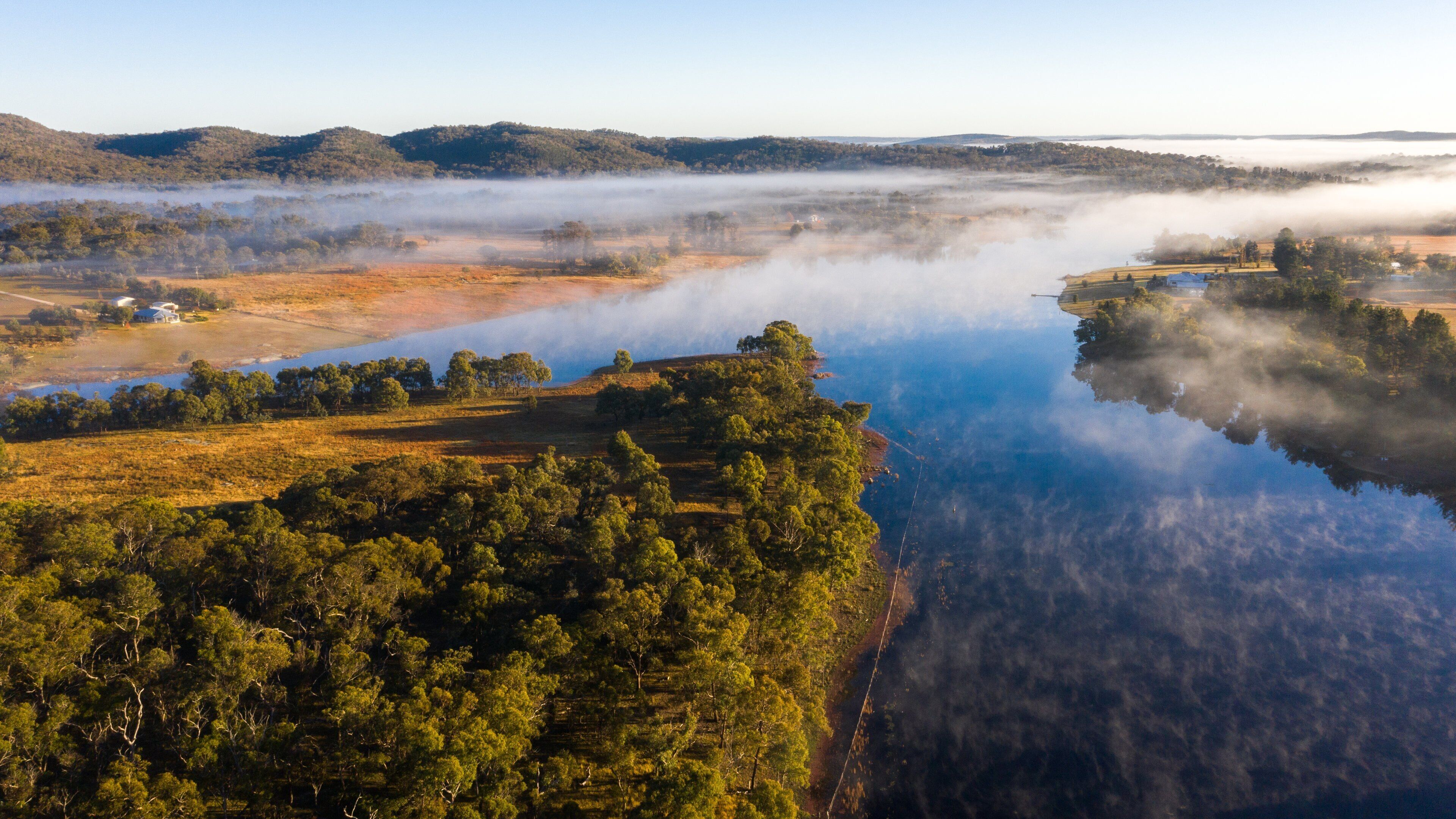 Storm King Dam showing a river or creek, mist or fog and landscape views