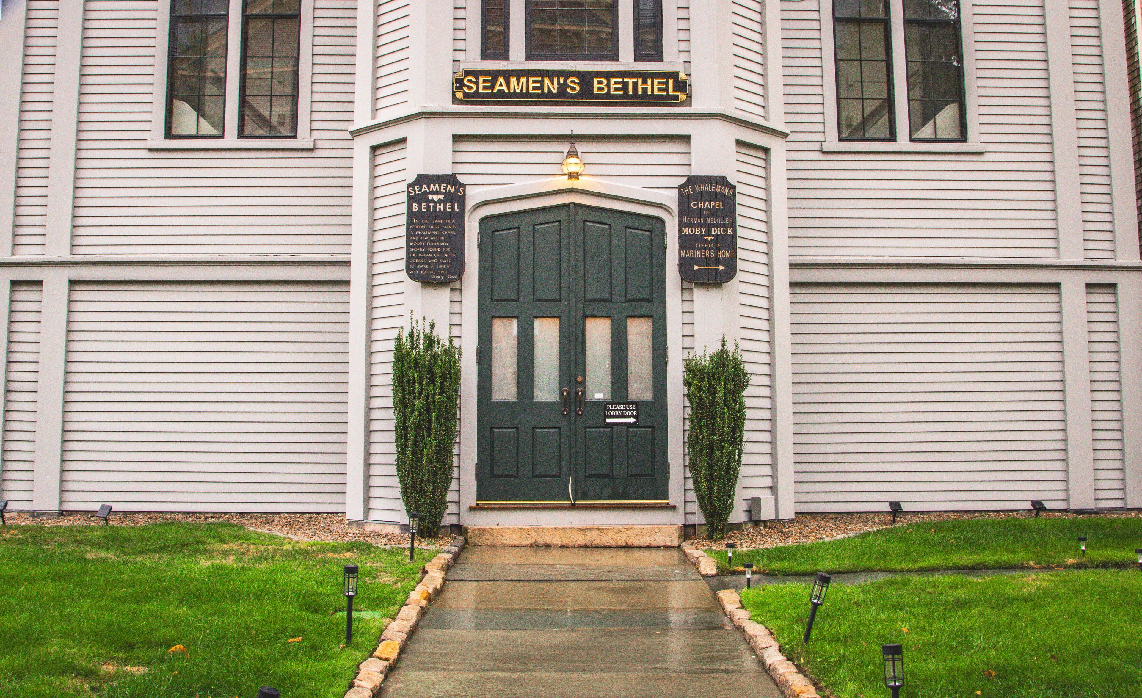 A building with a green door and the sign "Seamen's Bethel" above it.