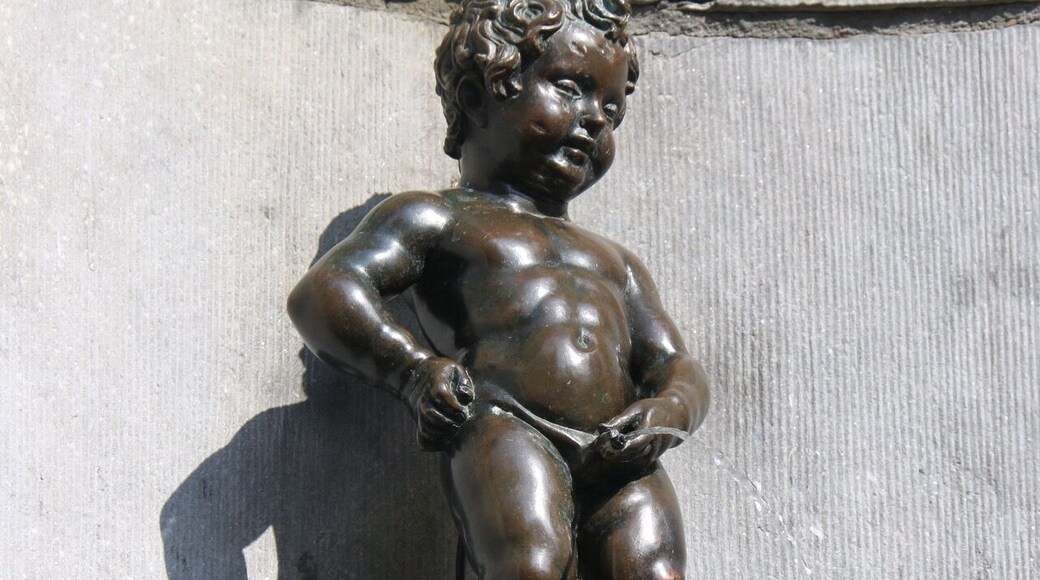 Manneken Pis is famous Brussels landmark put in place in 1618 or 1619 by Jerome Duquesnoy. It is known as Little Man Pee in Marols, a Dutch dialect spoken in Brussels. It is a small bronze fountain sculpture depicting a naked little boy urinating into the fountain's basin.