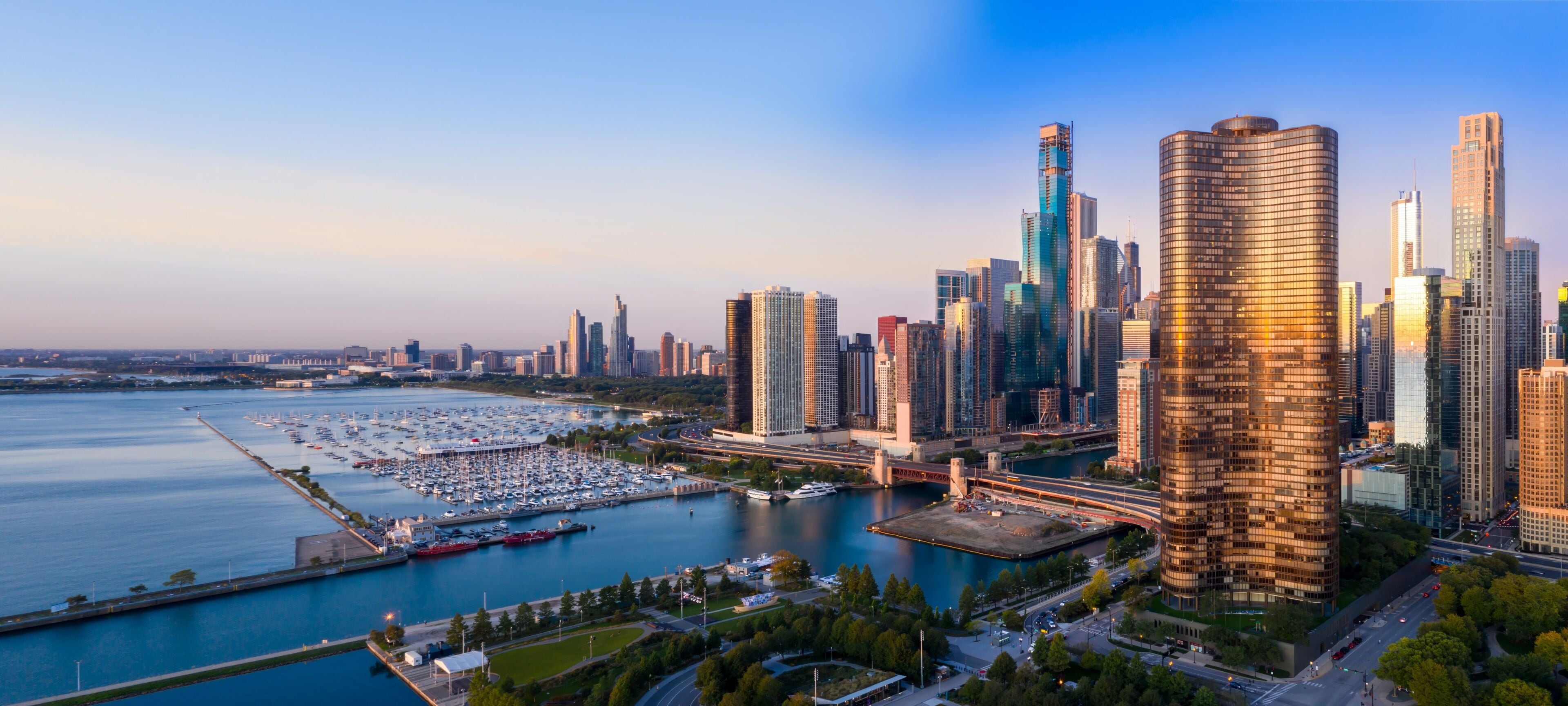 Chicago skyline at sunrise, showcasing the city's iconic architecture and harbor. Aerial view of the city's waterfront. Chicago Harbor, Chicago, Illinois, United States Of America
