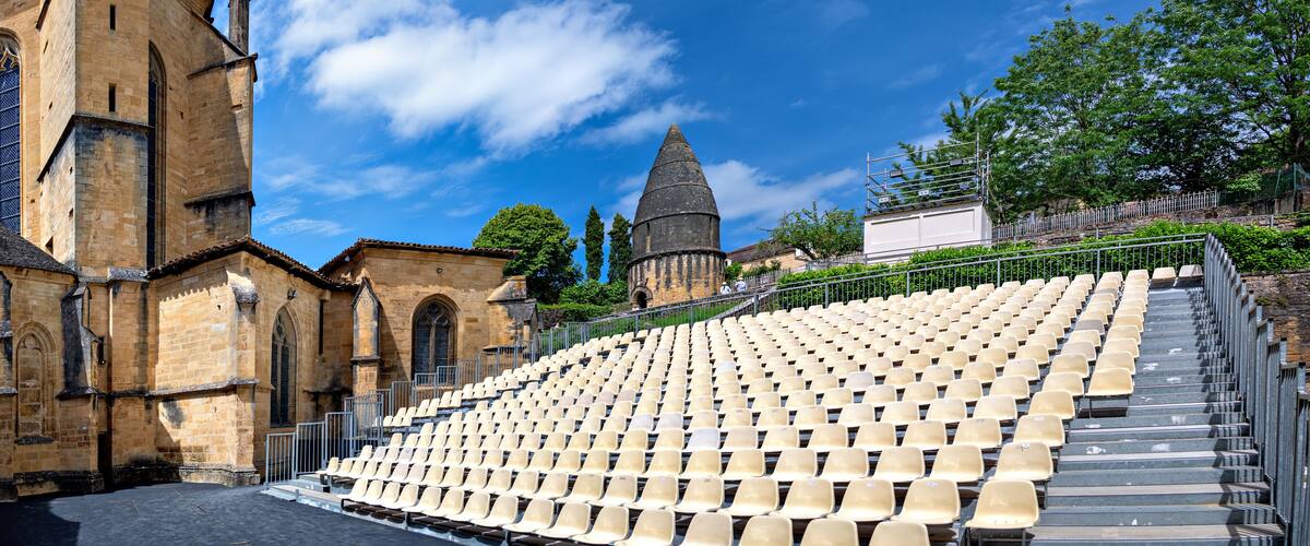 stand beside the cathedral of the Abbey of Saint-Sauveur und under the socalled lantern of the dead for the annual theatre festival in Sarlat-la-Canéda in the region Perigord, France