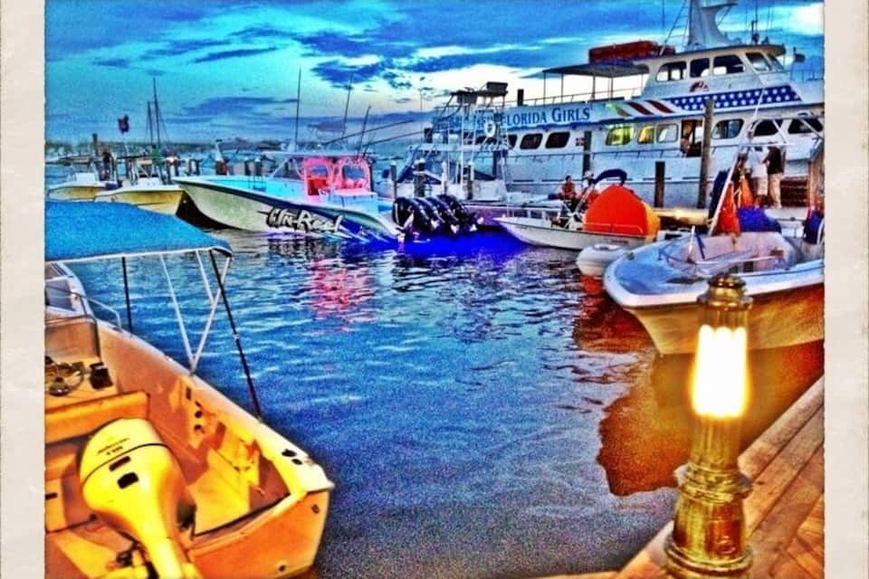 A harbor with boats docked, including one labeled 'Florida Girls'.