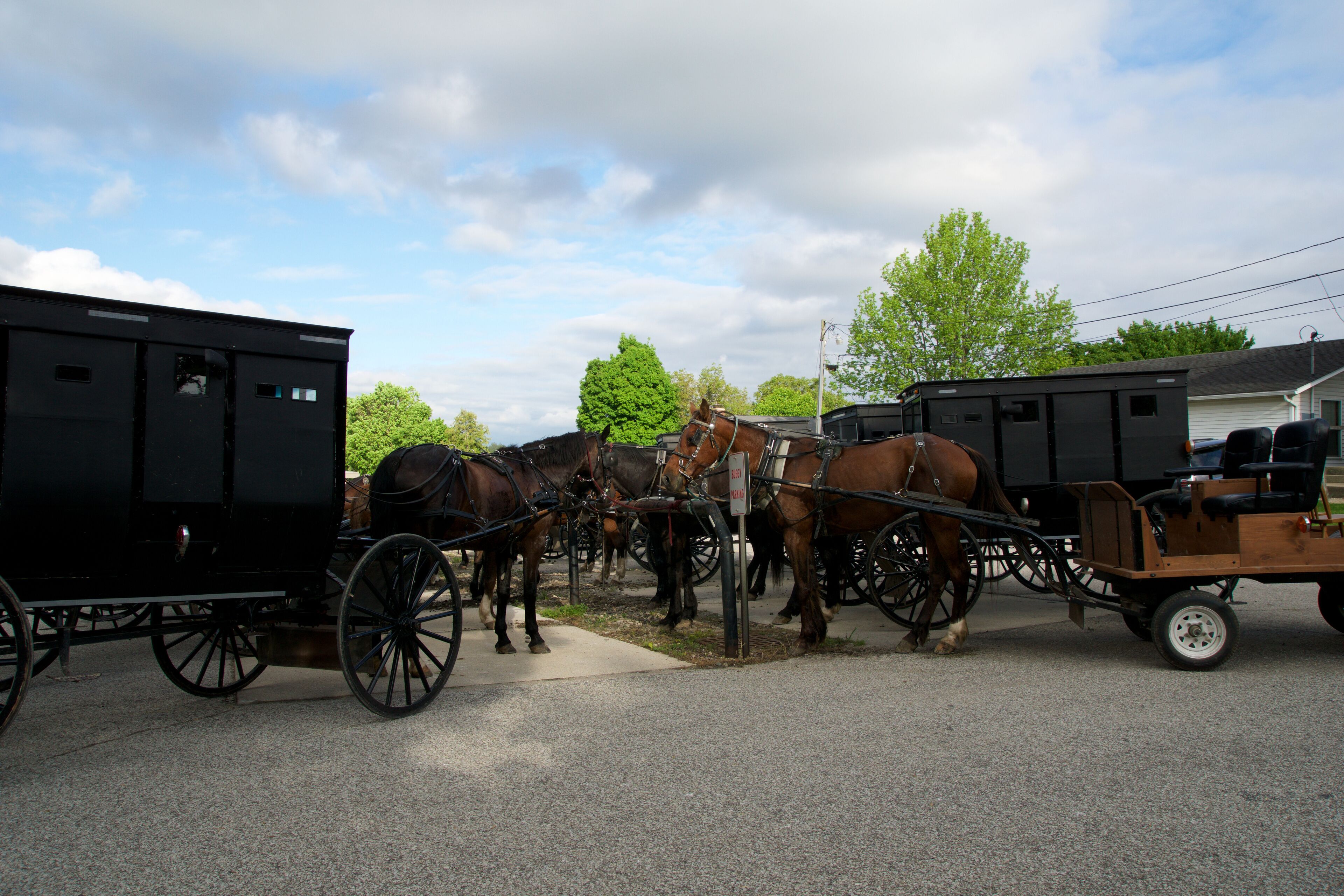 MIDDLEBURY, INDIANA, UNITED STATES - MAY 22nd, 2018: View of amish carriage along the city, known for simple living with touch of nature contacy, plain dress, and reluctance to adopt conveniences of