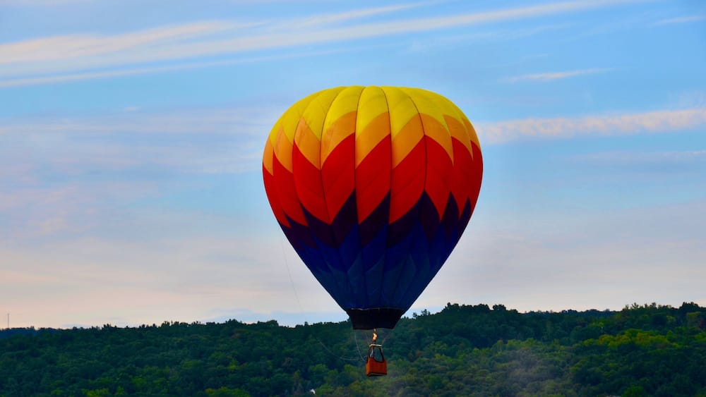 Hot air balloon flying in the sunset,