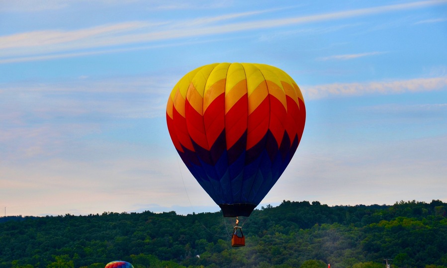 Hot air balloon flying in the sunset,