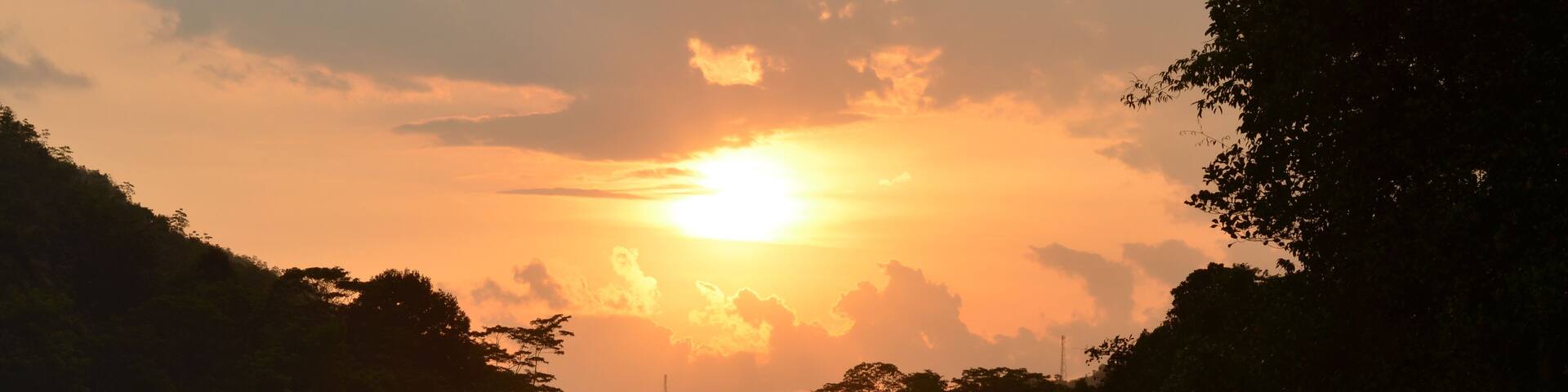 sunset over the river with a reflection. Seethawaka river , Sri Lanka.