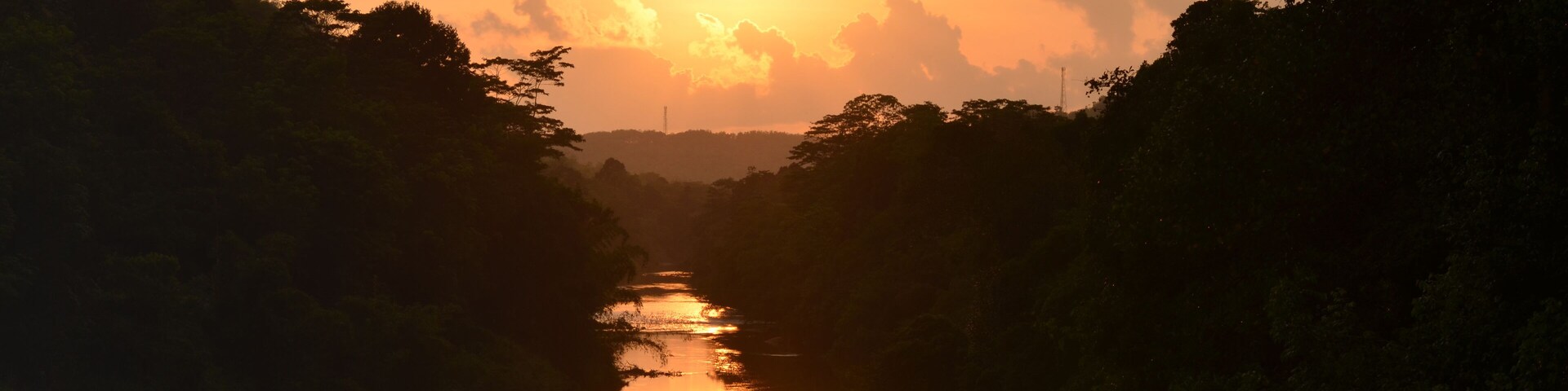 sunset over the river with a reflection. Seethawaka river , Sri Lanka.