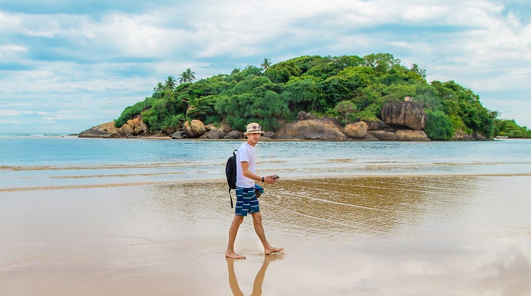A man walking along the beach of Sri Lanka. Selective focus.