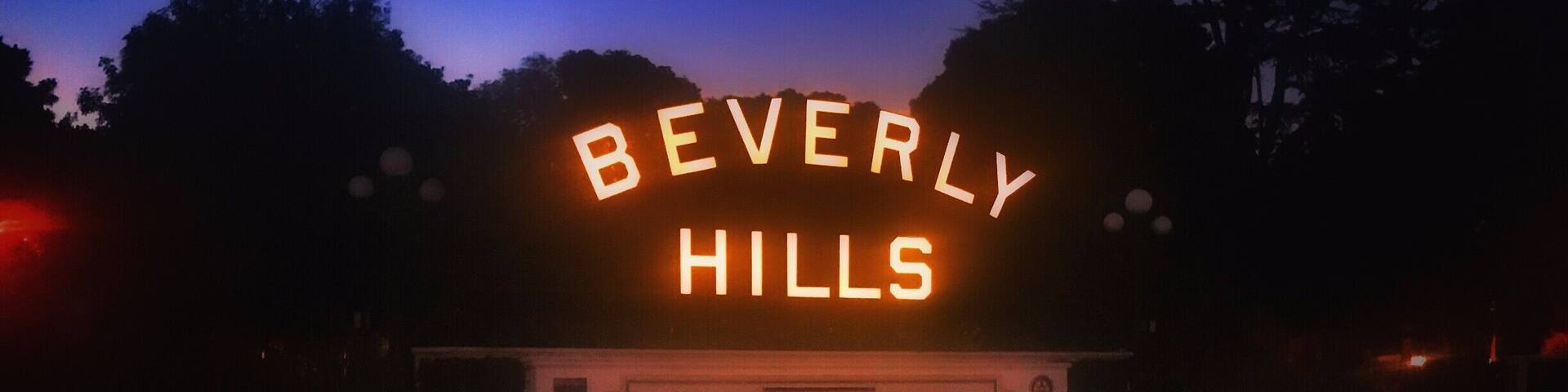 Beverly Hills is a city in California's Los Angeles County. Home to many Hollywood stars, it features the upscale shopping street of Rodeo Drive. The expansive Beverly Gardens Park has fountains and rose gardens, plus an illuminated Beverly Hills sign. The 1920s Greystone Mansion is the backdrop for many films. Known as a celebrity haunt, The Beverly Hills Hotel is set in tropical gardens and has a poolside cafe.