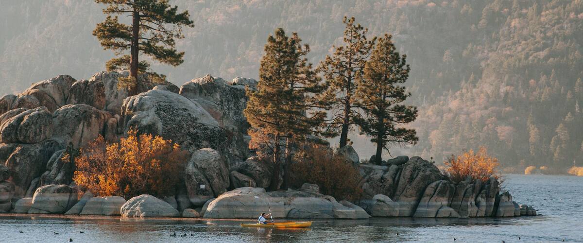 Big Bear Lake showing landscape views, forest scenes and kayaking or canoeing
