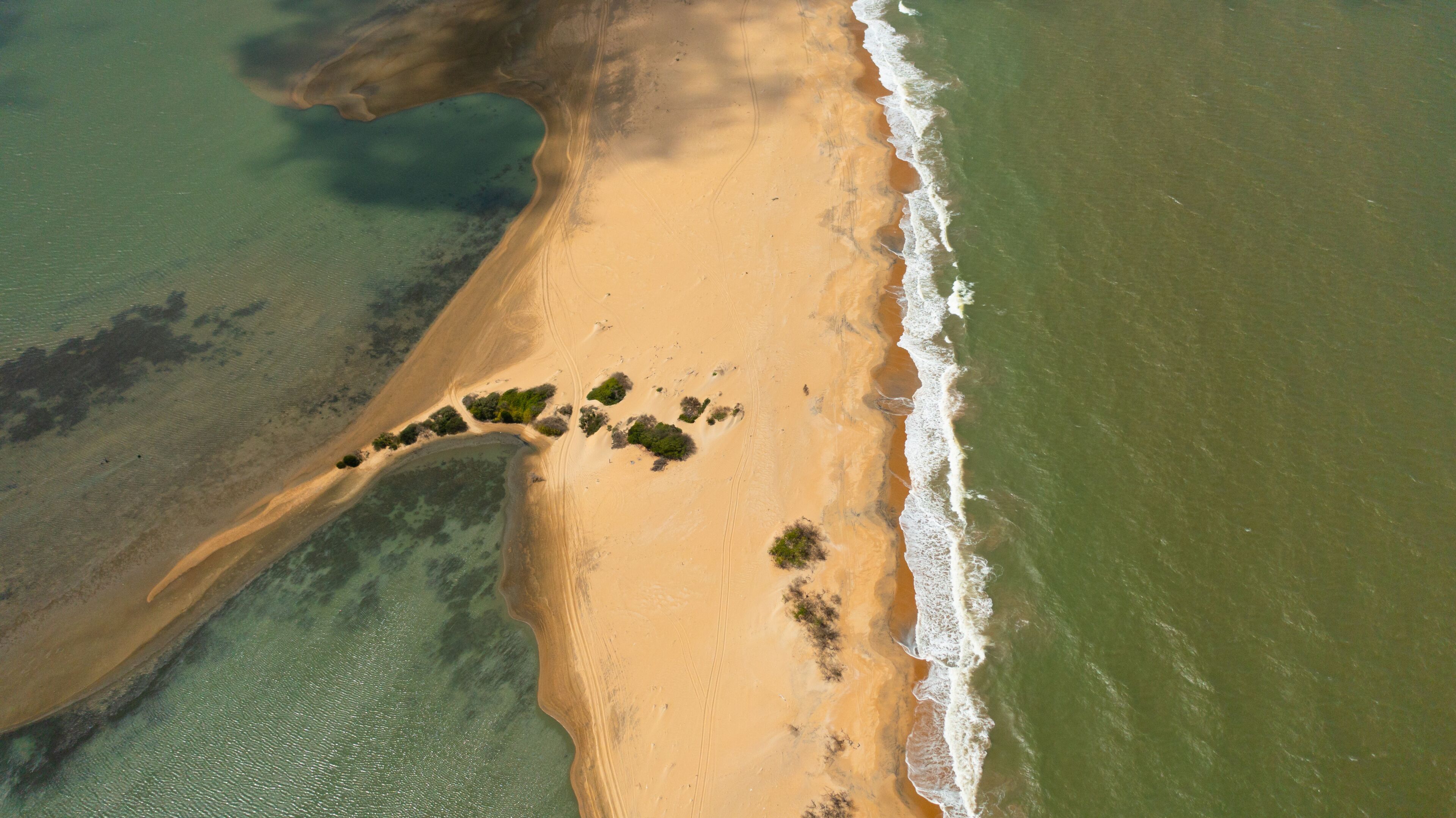 Top view of a beautiful sandy beach and ocean with waves. Kalpitiya, Sri Lanka.
