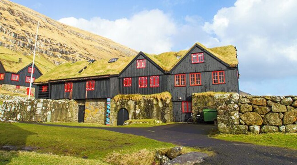 The hike from Torshavn to the old bishopric and royal residence where the Norwegian King Sverre grew up, takes a few hours. In the Middle Ages Kyrkjebo was the cultural and religious center in the Faroe Islands. The old log house is told to be Europe’s oldest timber building, around 900 years old. John Patursson is the host and farmer at Kyrkjebo, he’s 17. generation onsite. Read more on: http://www.travelwithallsenses.com/faroe-islands-treat-for-all-senses/