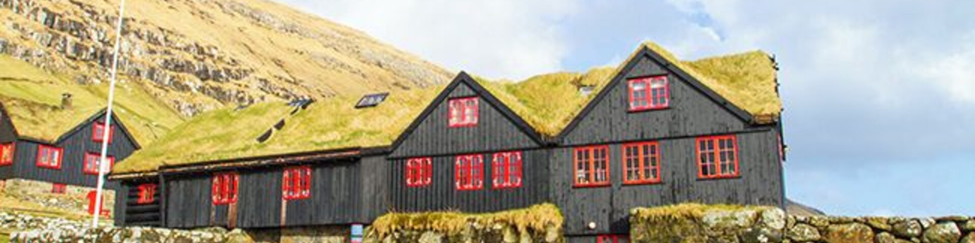 The hike from Torshavn to the old bishopric and royal residence where the Norwegian King Sverre grew up, takes a few hours. In the Middle Ages Kyrkjebo was the cultural and religious center in the Faroe Islands. The old log house is told to be Europe’s oldest timber building, around 900 years old. John Patursson is the host and farmer at Kyrkjebo, he’s 17. generation onsite. Read more on: http://www.travelwithallsenses.com/faroe-islands-treat-for-all-senses/