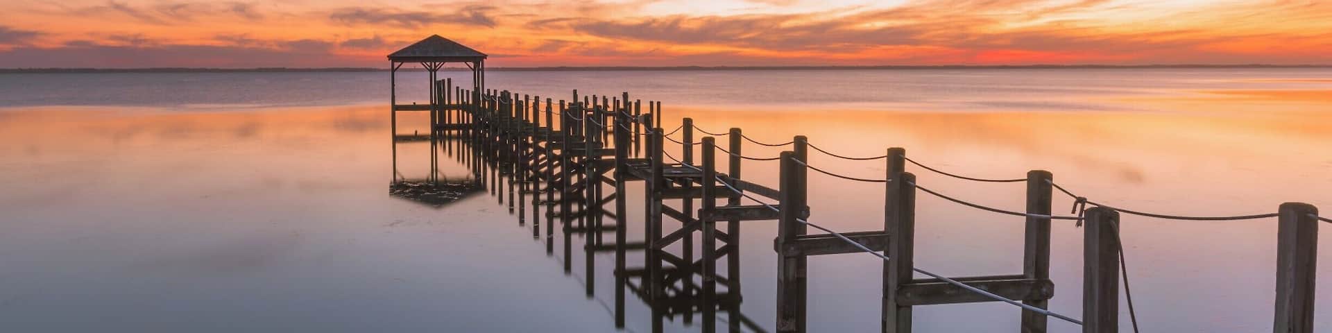 One of the northernmost towns along the coast in North Carolina, Duck is an idyllic town on the shores of the Currituck Sound. This shot was taken from the town's boardwalk while looking West over the sounds. It is advisable to visit the location in Winter as that is off season - so you can spend more time taking in the beauty of the North Carolina coastline and also sunsets are usually much more picturesque around the time owing to the cooler temperatures and lower amount of atmospheric haze.
Plenty of things around Duck to see. Further north, there is the Currituck Lighthouse where you can climb the steps to the top of the lighthouse. North of Corolla, there is an area where you can drive along the coast on the sand - 4X4s a must. Here you can spot some Spanish Mustangs, horses out in the wild. If you're lucky, you can spot them running along the beach in the surf. I'd recommend taking a tour through the Corolla Wild Horse Fund - the money from the tours is used to help the wild horses in every which way possible and the staff are knowledgeable and friendly.
Thank you for stopping by and for the support.
#colorful #goldenhour #weekend #waterlust #bestof5