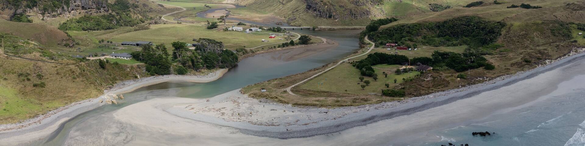 Farmland and the rivermouth of Paturau, Mangarakau, Collingwood, Tasman, New Zealand.