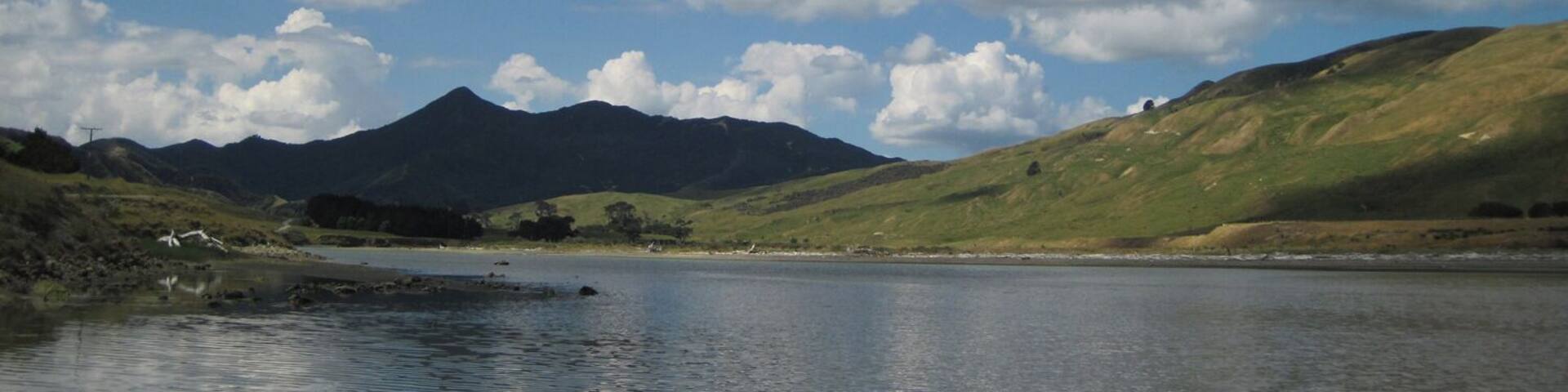 Looking inland from the Pahaoa River's mouth, where it spills into the ocean.