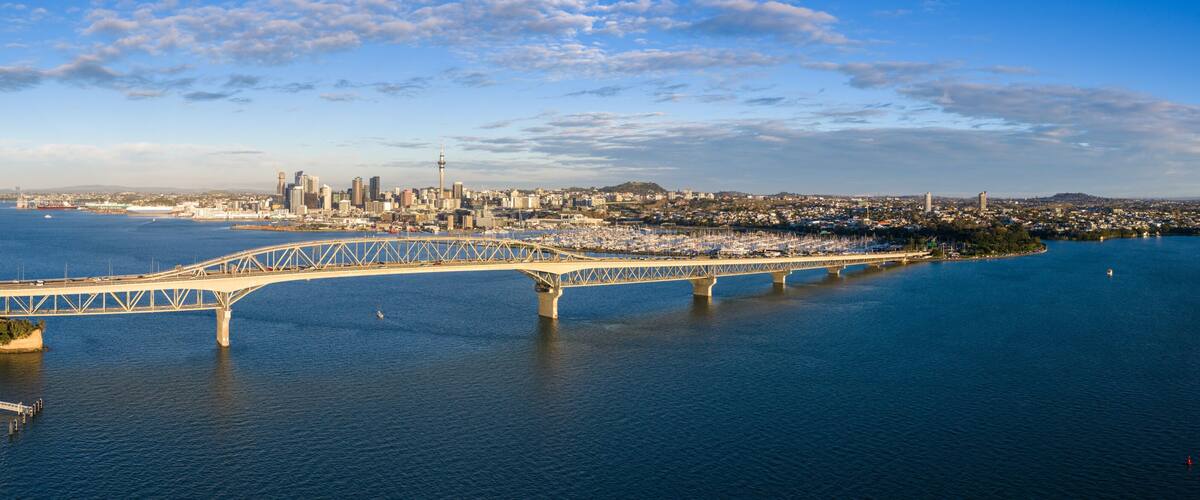 Auckland Harbour Bridge connects the city centre to the North Shore, carrying traffic over Waitemata Harbour in Auckland, New Zealand.