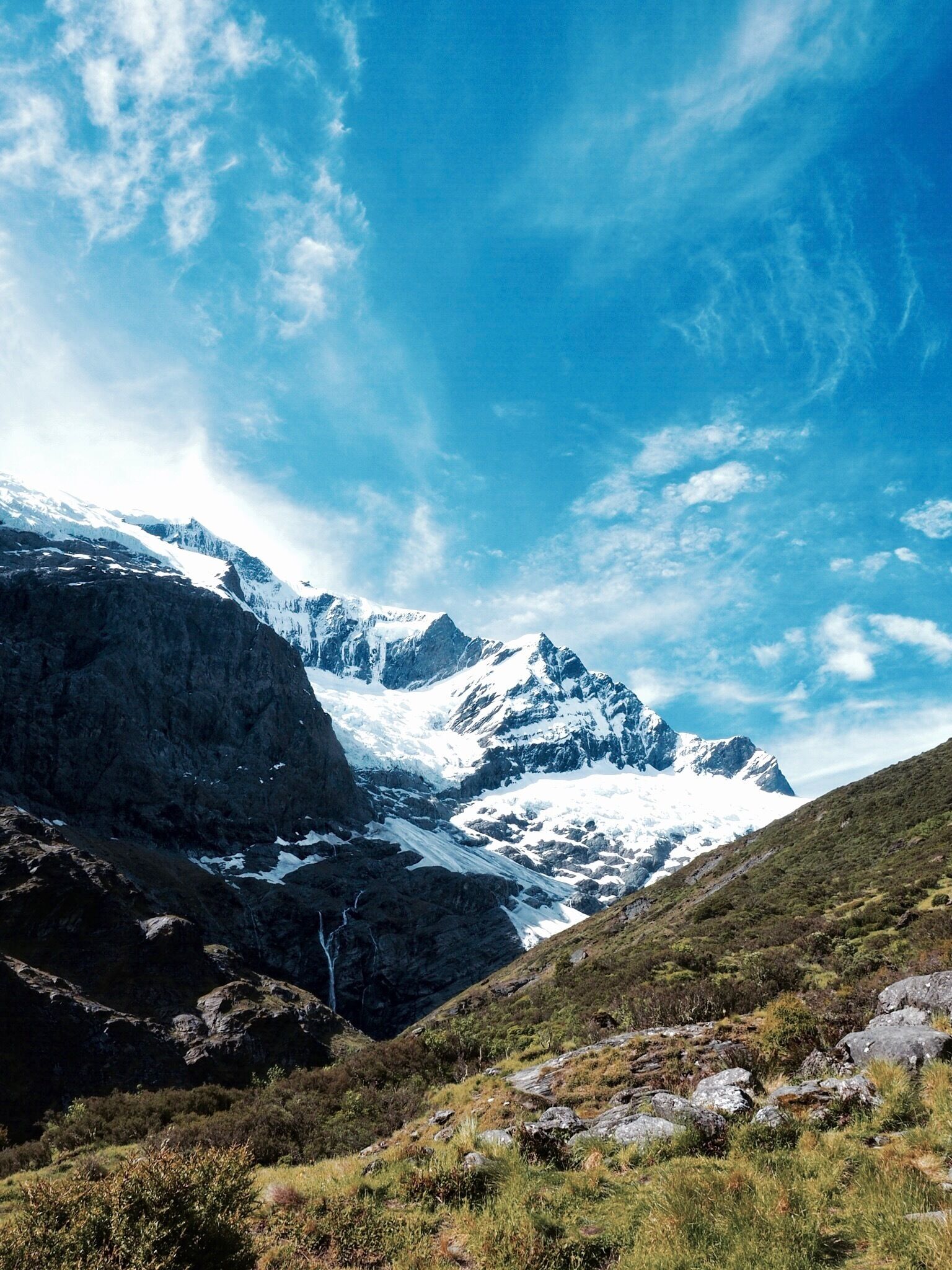 Rob Roy's Glacier was an impromptu 10km hike in NZ's South Island that we enjoyably completed with our 3 children.
I mention that to provide some insight into the level of fitness needed. That being said, my children are active and fairly savvy hikers, so one should still be prepared for a rocky, and  at times muddy path. Slippery in some sections, and an extremely varied landscape which changes dramatically whilst passing through the different sections of the track.
The finale is this view of Rob Roy's Glacier. This was my favourite walk completed in NZ. It's truly spectacular. 