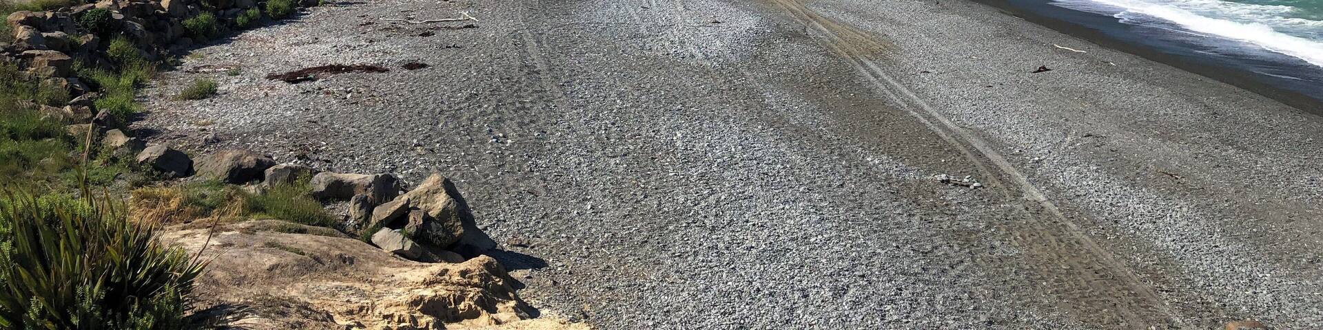 In the distance, you can see a tiny lighthouse. Timaru, New Zealand