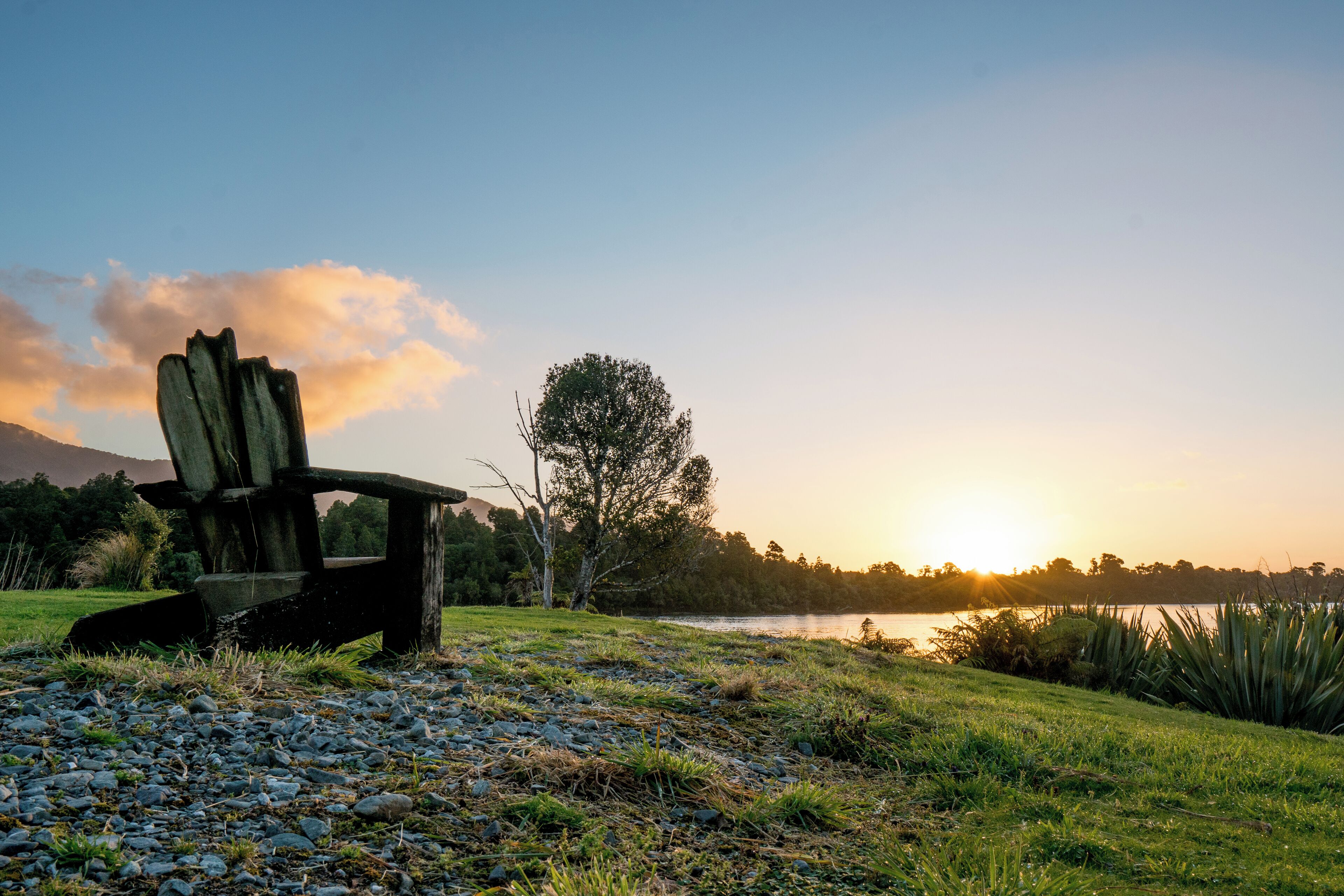 Relax with a glass of wine and enjoy the sunset over Martins Bay