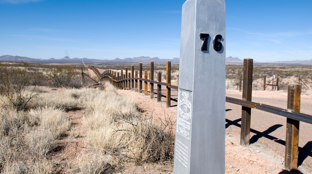The new post & rail border fence runs next to the original border markers, Arizona.