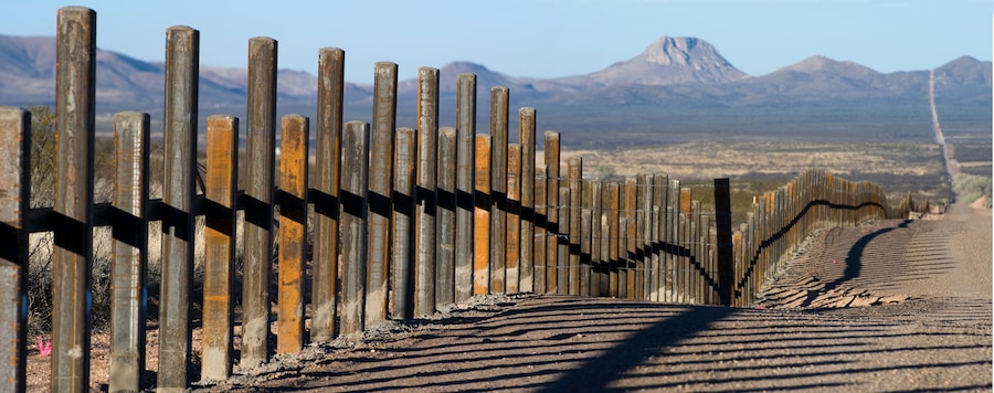 The new post & rail border fence runs along the Mexico border with Arizona.